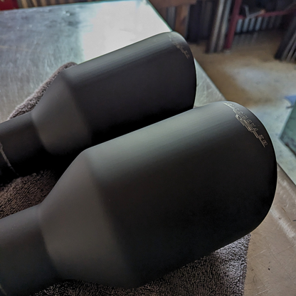 Black exhaust tips for a Ram 1500